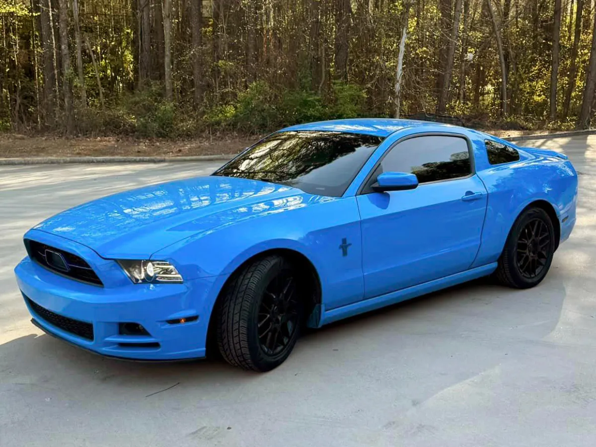 blue mustang with dark tinted windows
