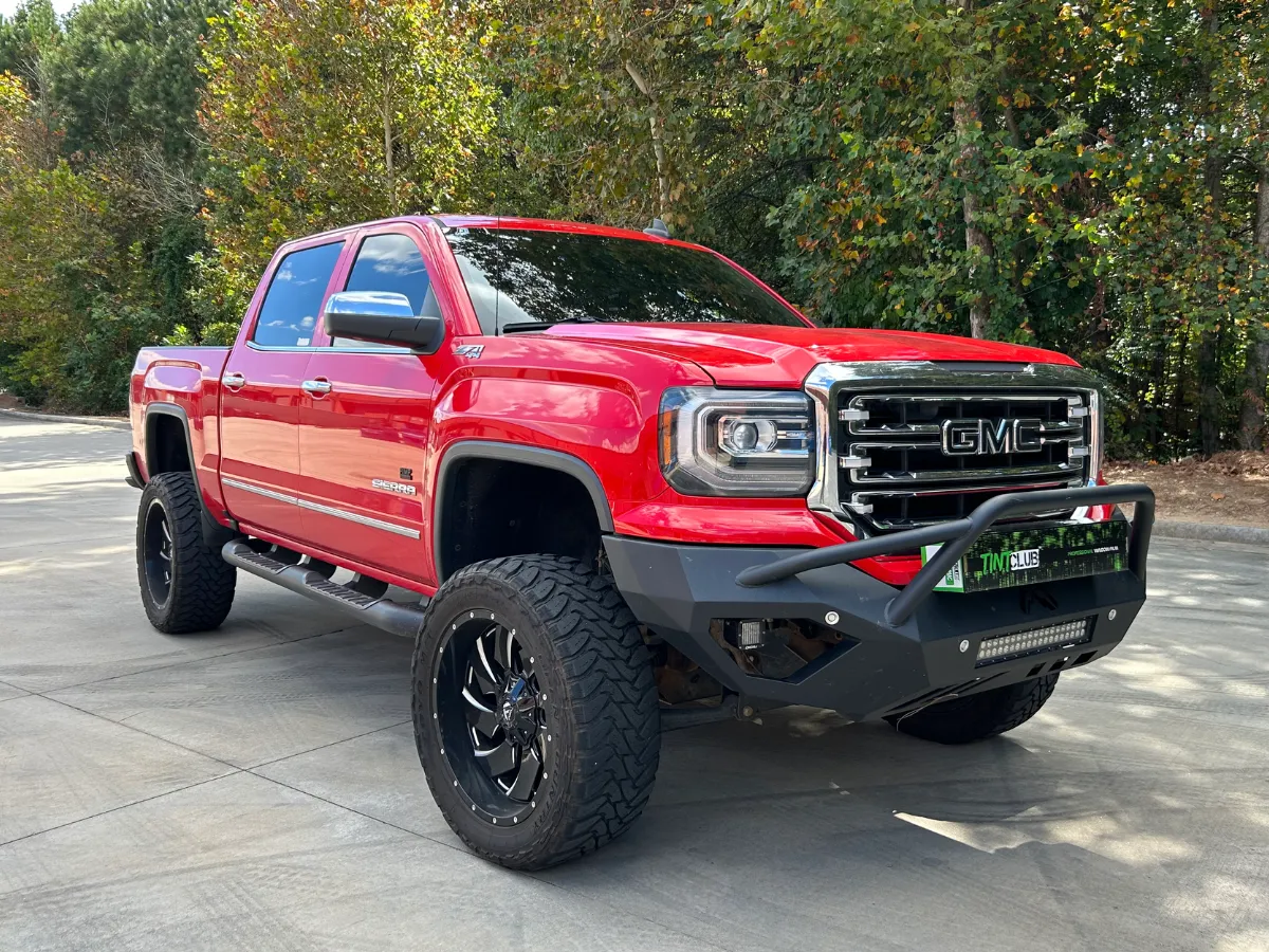 red color gmc after window tinting service